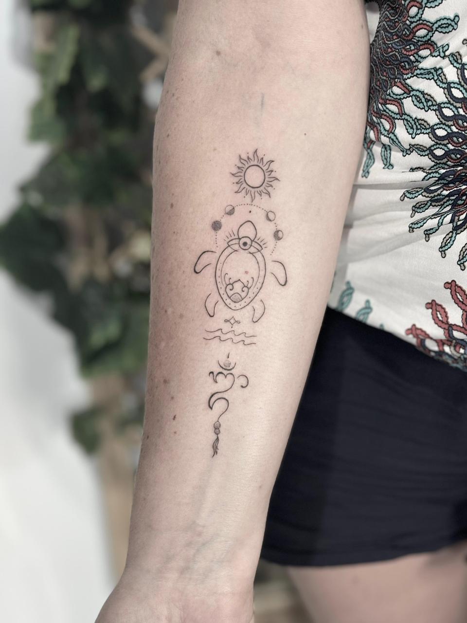 Microrealism turtle and sun tattoo Seminyak