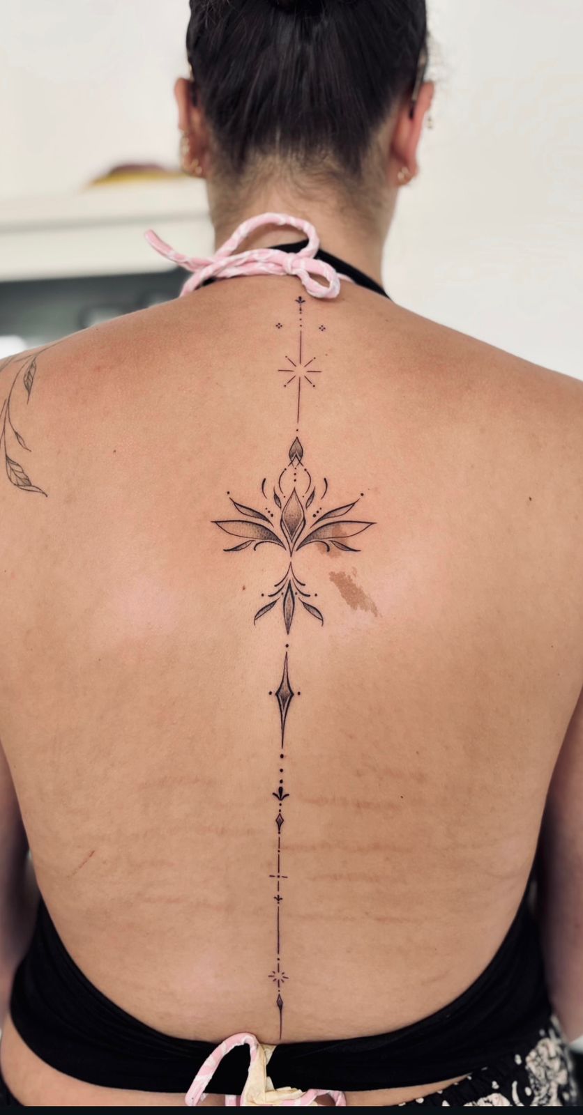 Fine line wrist tattoo Bali