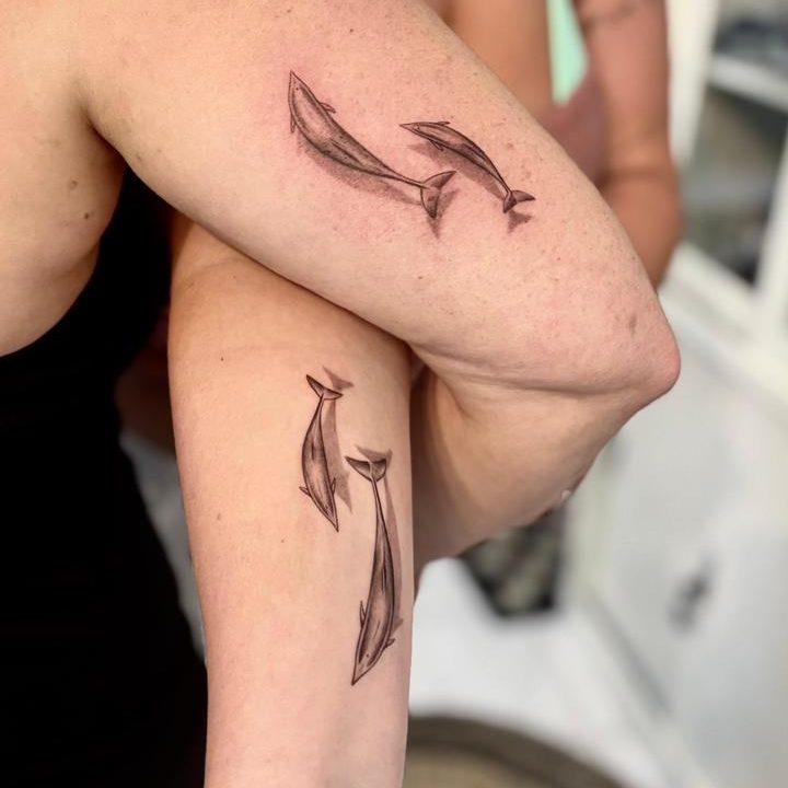 Healed yin yang fine line koi fish tattoo done in Bali